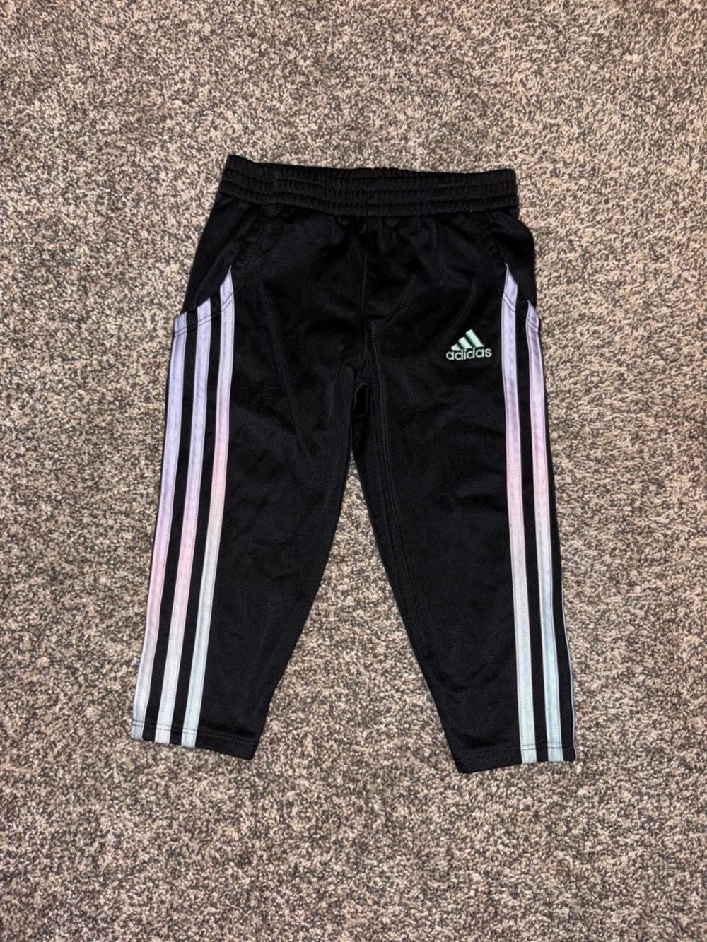 Adidas black sweatpants with teal and purple accents